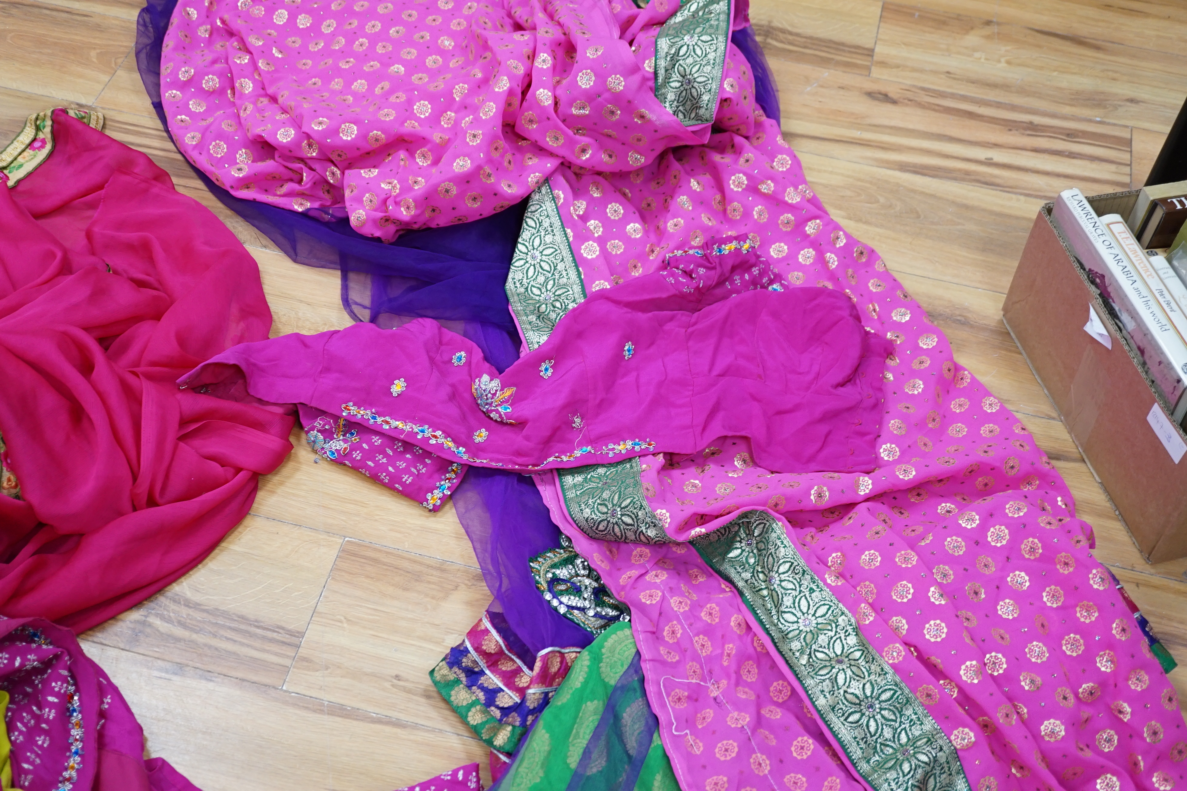 A collection of Indian silk saris and costume possibly bridal